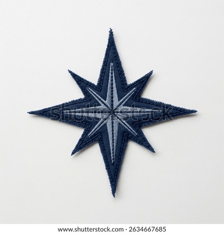 Textile patch in the form of a wind rose star on a white background