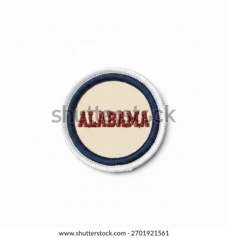 A textile patch with the word "Alabama"