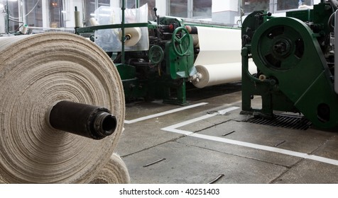 Textile Roll Factory Fabric Mill Knit Plant With Roll In Front View And Machines In Background Textile Roll Factory Fabric Mill Line Plant Indoor Weave Active Work Machine Practice Texture Lace Indust