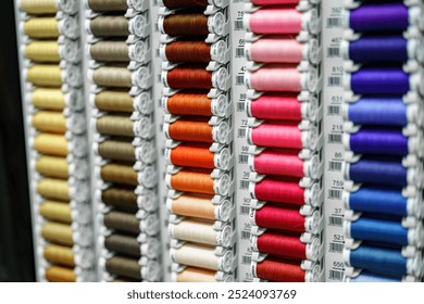 Textile threads on a shelf in a store.