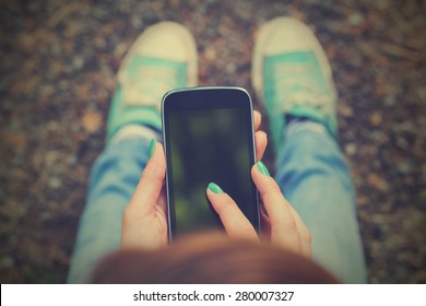 Texting On A Smartphone. Shallow Depth Of Field.