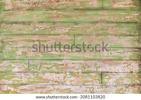 texture of aged wooden boards with greenish tone.