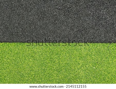 Texture of artificial grass background, half two colors green and black, macro. Structure of artificial grass carpet closeup. High quality photo