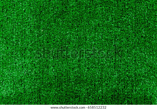 The texture of an artificial lawn of green color.\
View from above.