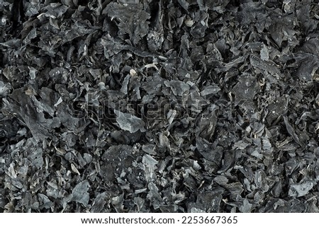 Texture of ash from burnt paper, as background. Cinder.