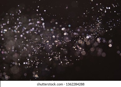 Texture Background Abstract Black And White Or Silver Glitter And Elegant For Christmas. Dust White. Sparkling Magical Dust Particles. Magic Concept. Abstract Background With Bokeh Effect.