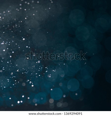 Texture background abstract black and white or silver Glitter and elegant for Christmas. Dust white. Sparkling magical dust particles. Magic concept. Abstract background with bokeh effect.