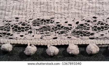 Texture background, female lace scarf. Arrived quickly and beautifully, silver color. The scarf is thin but very attractive and very well made with no loose yarn or loose parts.