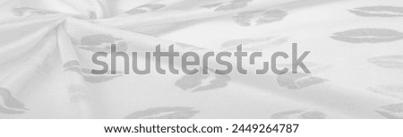 Texture, background, ground context, fond, foil field, silk fabric in black and white with lip prints of kisses