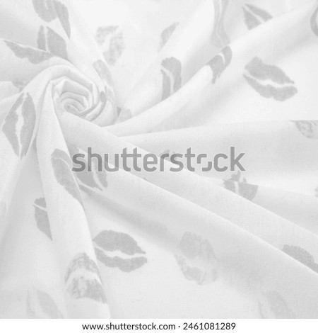 Texture, background, ground context, fond, foil field, silk fabric in black and white with lip prints of kisses