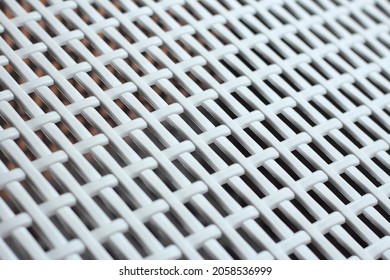 Texture background lattice: white plastic grating, grid or wicker grate in perspective. Venting, ventilation