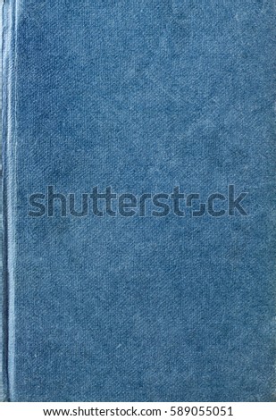 Texture background of an old, scratched, lightly worn and marked blue fabric woven book cover.