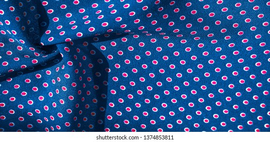 Texture background, pattern, blue silk fabric with red polka dots. Light and silky-soft satin pendant is perfect for your design, online projects. It is also perfect for screensavers and wallpapers.
