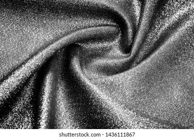 Texture, background, pattern. Cloth Gray black coated with a metallic silver thread. These fabrics are ideal for any project, wallpaper, all design solutions. and many uses of ships.