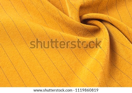 Texture, background, pattern. Cloth is light brown with a thin black stripe. Fabrics, this very lightweight woven cotton blend seersucker fabric is light and summery. 