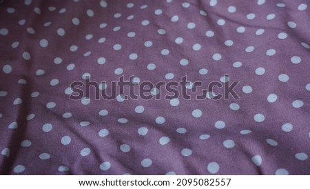 Texture, background, pattern. cotton fabric purple with polkadot. decorative ornament, red polka dot fabric in white polka dots, round dots, shaped like or approximately like circle