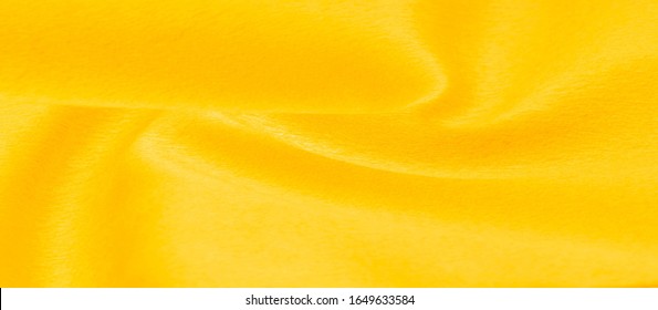 Texture background pattern Fabric warm wool yellow A pair of acrylic felt fabric has a phenomenal color. Condensation of felt oil and pressing the fibers together This is a special fabric for design