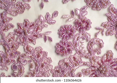 Texture, background, pattern.  Luxury 3D Beaded lace fabric, hand made Pink pearl beads 3D flowers, pink French Embroidered lace, Beads Wedding Lace