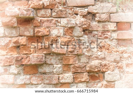Texture, background, pattern. Picturesque old ruined brick wall. 