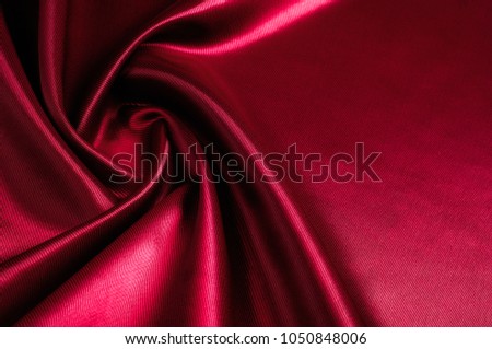 Texture, background, pattern. Red silk fabric.This satin fabric is perfect for making fabric flowers for use in hair accessories, jewery making, and fabric bouquets. 