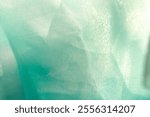 Texture, background, pattern. Silk fabric in aquamarine as background. abstract folds.
Smooth elegant color silk or satin texture. turquoise, blue, green, teal, aquamarine, mint green, cyan blue