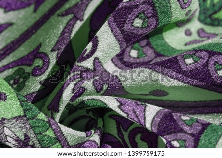 Texture background pattern , silk fabric, moderate soothing colors, royal monogram pattern, white, green azure colors on the fabric. 