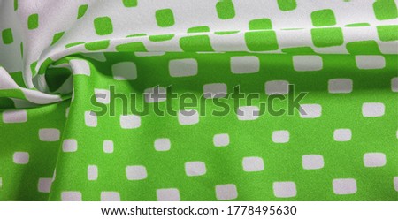 texture background pattern. Silk fabric with a pattern of green squares on a white background. This is a heavy square 100% polyester pattern that fits perfectly with modern, transitional or contempora