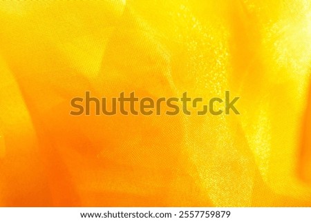 Texture, background, pattern. Silk fabric in golden yellow as background. abstract folds.
Smooth elegant color silk or satin texture. lemon sunflower daffodil banana corn butter canary gold dandelion 