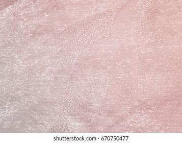 Texture, background, pattern. Tulle of pastel pink tones. Abstract background of pink fabric. Soft texture of the fabric, pink pastel tone. Shabby chic style. Crumpled tulle as a background.