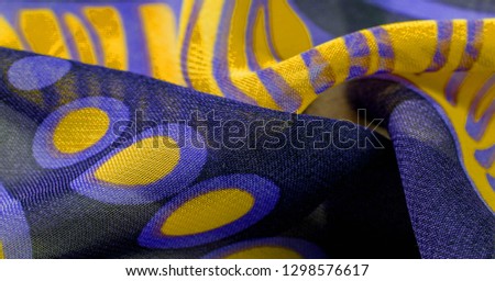 texture background pattern wallpaper. blue black yellow silk fabric pattern. This medium-weight rayon fabric has a nice shine with slight color variations. Perfect for adding elegance to your designs