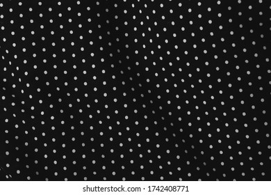 Texture Background Pattern. White polka dots on Black Fabric Material