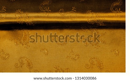 Texture background pattern Yellow mustard brown chiffon fabric with paisley print High quality pure silk chiffon fabric bright beautiful color combinations This fabric is suitable for design wallpaper