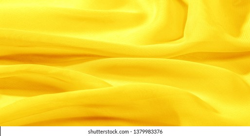 texture background pattern yellow silk fabric. This silk organza has a gentle open weave. Use this luxurious fabric for anything from your design for special occasions to creating your projects. - Powered by Shutterstock