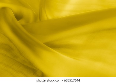 Texture, background, pattern. Yellow transparent silk fabric. Sunshine Yellow Silk Charmeuse Satin,  - Shutterstock ID 685517644