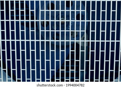 Texture background: protective gray metal iron grating, grid or stainless steel grate in perspective. Venting, ventilation