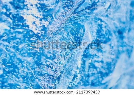 Texture background of pure natural water concept. Drinking water. Selective focus. Wave, whirlpool and splash. Place to insert an inscription or logo.