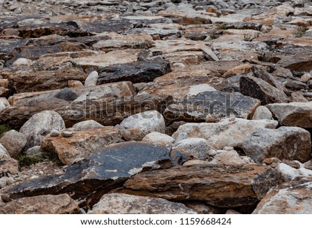 Texture and background of rock stones. Road from stones. Pebble.