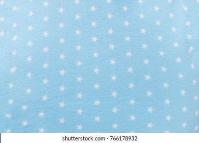 Texture Background Of A Star Shape Blue Wool Blanket.