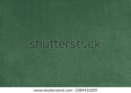 Texture background of velours green fabric. Upholstery texture fabric, velvet furniture textile material, design interior, decor. Fleecy fabric texture close up, backdrop, wallpaper.