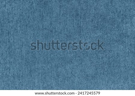 Texture background of velours jacquard blue fabric. Upholstery texture fabric, velvet furniture textile material, design interior, decor. Fleecy fabric texture close up, backdrop, wallpaper.