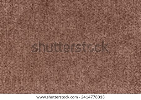 Texture background of velours jacquard brown fabric. Upholstery texture fabric, velvet furniture textile material, design interior, decor. Fleecy fabric texture close up, backdrop, wallpaper.