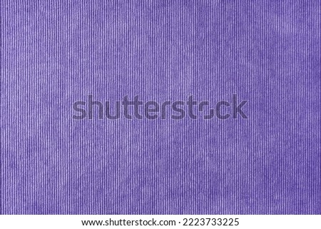 Texture background of velours purple fabric. Upholstery velveteen texture fabric, corduroy furniture textile material, design interior, decor. Ridge fabric texture close up, backdrop, wallpaper.