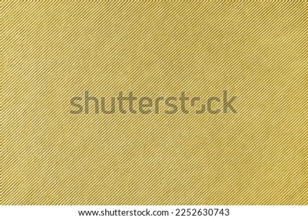 Texture background of velours yellow fabric. Upholstery velveteen texture fabric, corduroy furniture textile material, design interior, decor. Ridge fabric texture close up, backdrop, wallpaper.