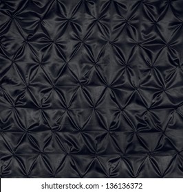 The texture of black fabric close up.