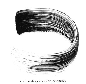 Texture of black mascara for eyelashes isolated on white background. Smear of black mascara for eyelashes on white background.