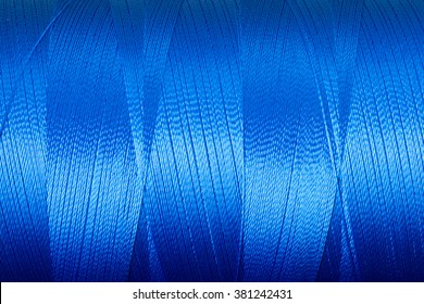 texture of blue thread in spool