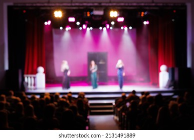 Texture blur and defocus, background for design. Stage light at a concert show. Artists perform on scene in light and smoke.