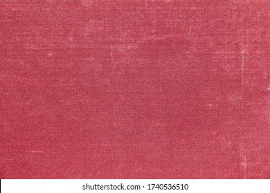 The texture of the book's hardcover is red with spots and scuffs