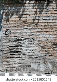 The texture of bricks damaged by wind erosion and rainwater erosion. can be used for background.