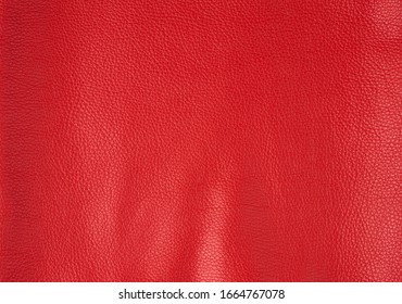 texture of bright red cow leather, scarlet color, full frame